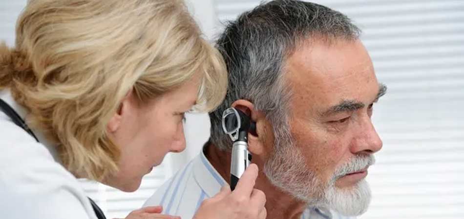 Doctor Looking in Patient's Ear