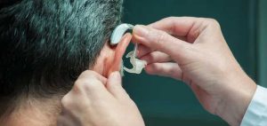 Man Being Fitted for a Hearing Aid