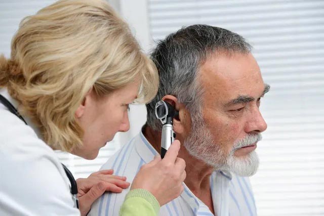 Doctor Looking in Patient's Ear